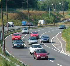 cars driving down a busy road